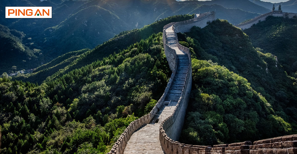 Photo of great wall of China sprawling into the distance, during the day. Ping An logo in top left.