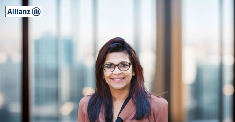 Profile photo of Shez Ford with blurred office background.