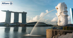 Photo of Singapore Merlion stattue with in Marina Bay Sand in background. Allianz logo in top left corner.