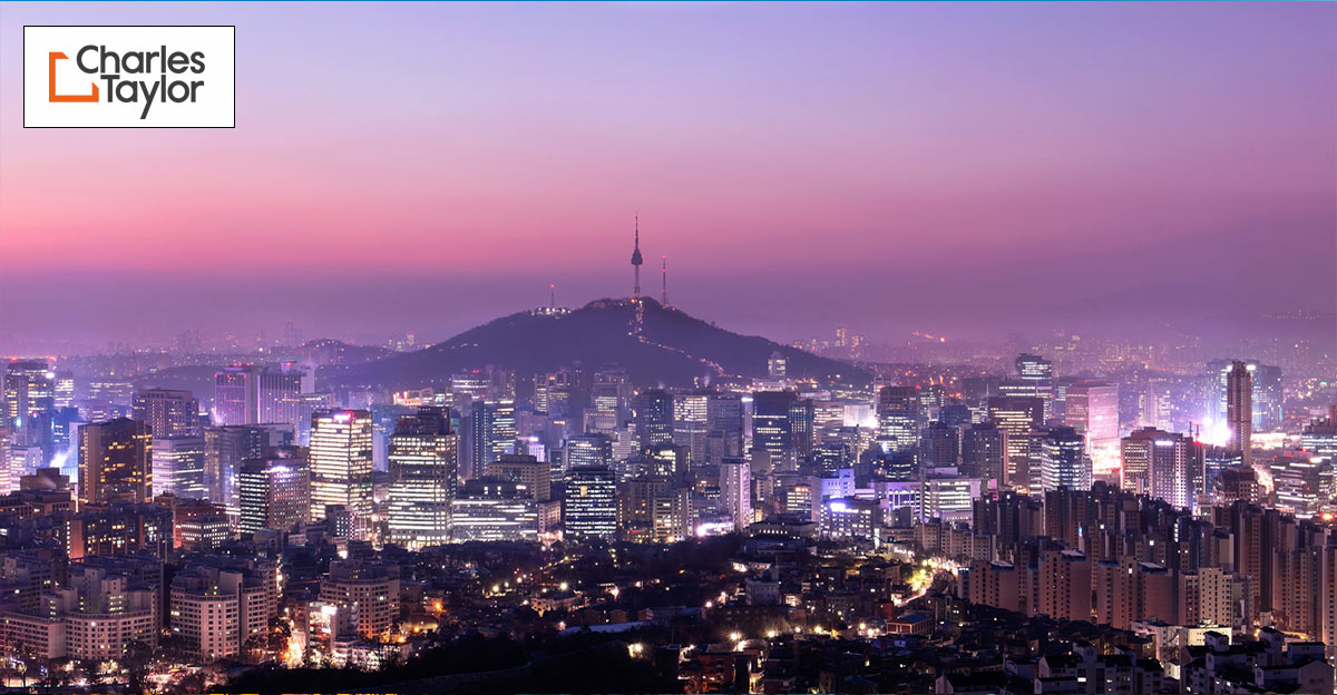 Beautiful photo of Korean city landscape. Charles Taylor logo in top left corner.
