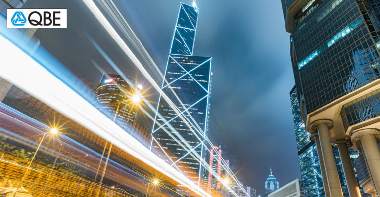 Photo of Hong Kong buildings with effect of something speeding by.