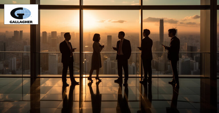 Photo of Japanese business people overlooking city. Gallagher logo in top left corner.