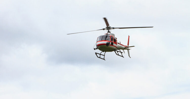 Photo of helicotper in the sky.