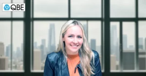 Profile photo of Serene Davis with blurred office background.