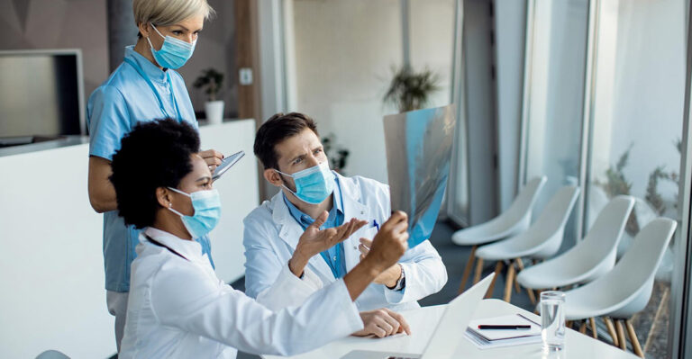 Photo of Doctors/Nurses looing at xray.