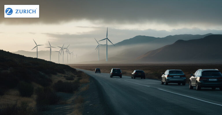 Photo of cars driving with windmills in the distance. Zurich logo in the top left.