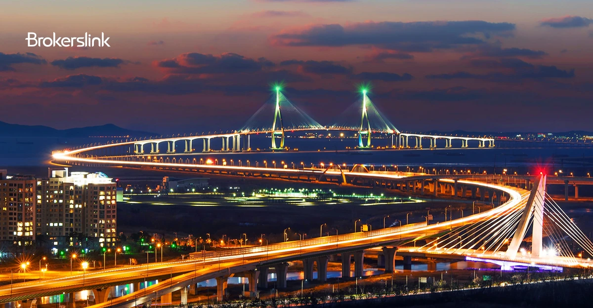 A photo of a bridge in South Korea. Brokerslink logo in top left corner.