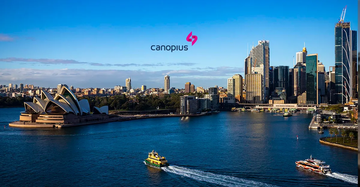 A photo of Sydney Harbour. Canopius logo in top centre.