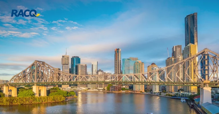 A photo of a bridge in Brisbane. RACQ logo in top left corner.