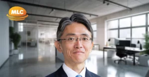 A profile photo of Hiroyuki Endo with blurred office background.