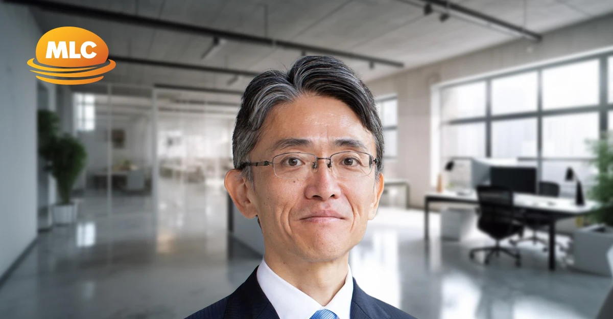 A profile photo of Hiroyuki Endo with blurred office background.