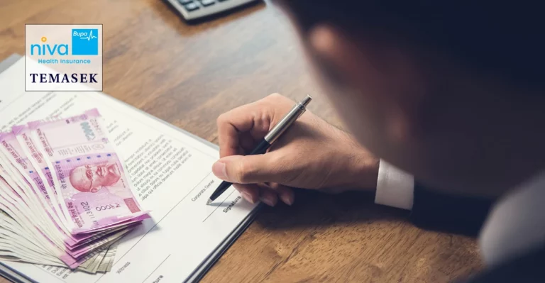 A photo of someone signing a contract with rupees on time. Niva and Temasek logo in top left corner.