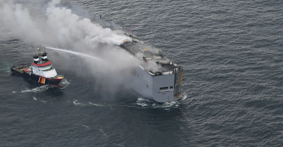 Japanese vessel with indian seafarers engulfed in flames salvage operations taking place