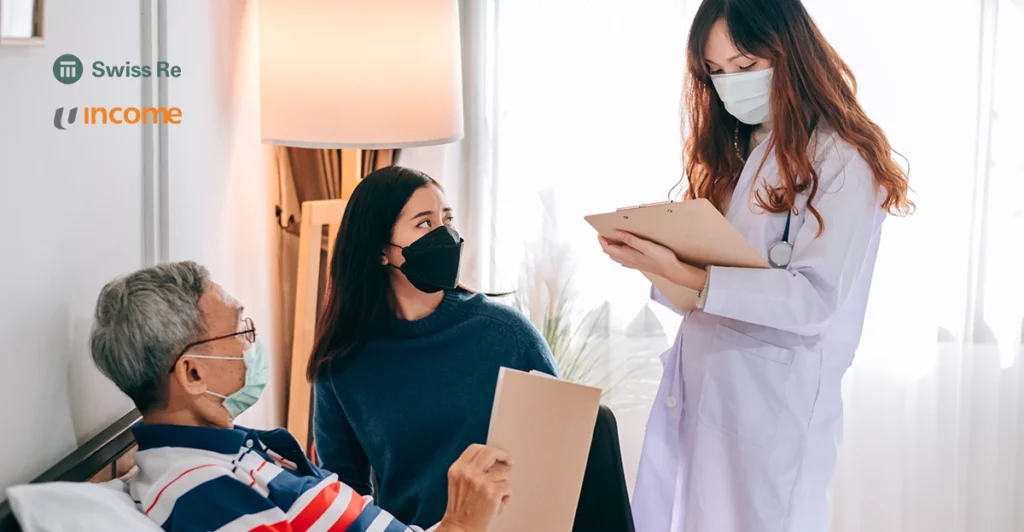 A nurse is talking to a patient in a hospital bed.