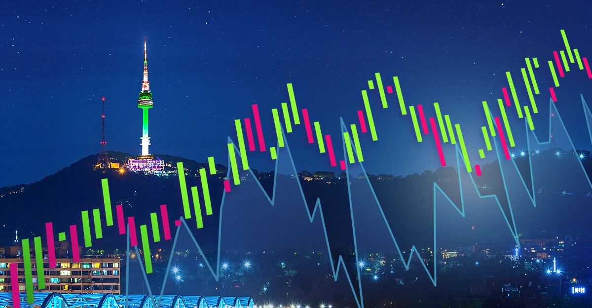 An image of a stock chart with a city in the background.