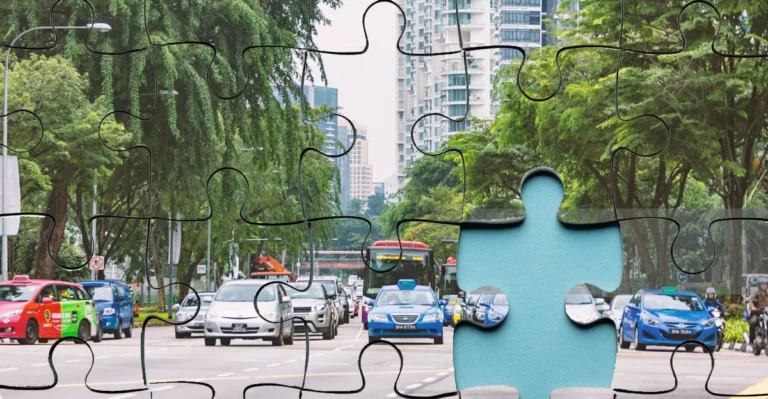 A blue jigsaw puzzle with cars on the street.