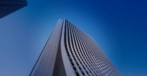 An image of a tall building against a blue sky.