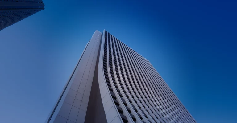 An image of a tall building against a blue sky.