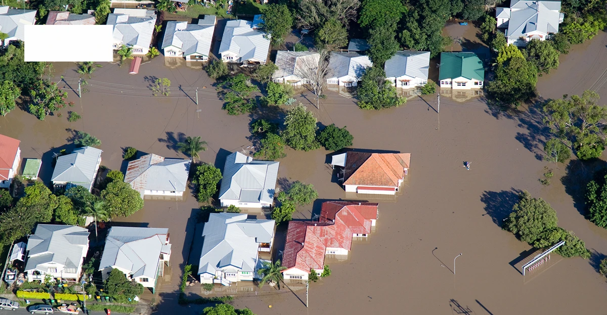 An aerial view of flooded houses in brisbane.