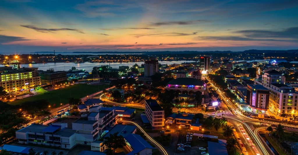 An aerial view of a city at dusk.