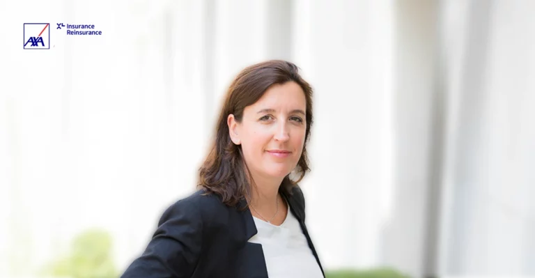 A woman in a business suit is posing for a photo.