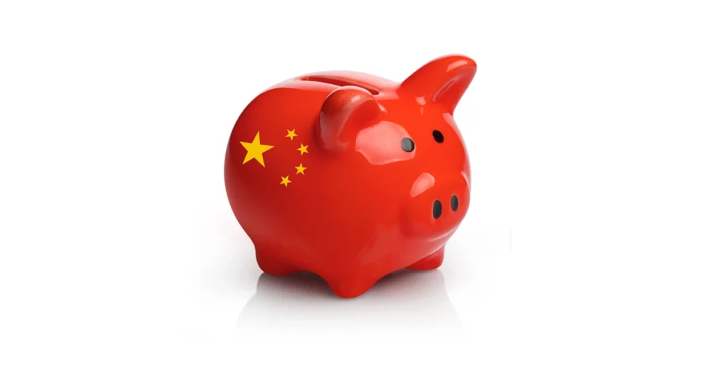 A red piggy bank with the chinese flag on it.