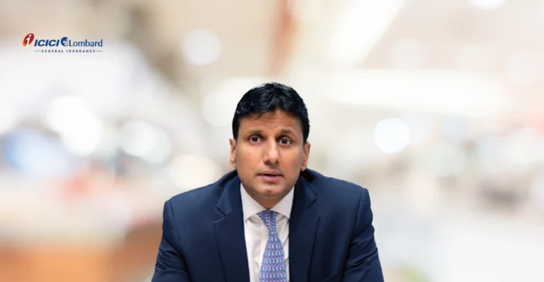 A man in a suit and tie sitting at a table.