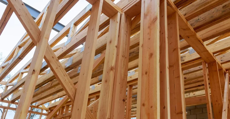 A house under construction with wooden framing.