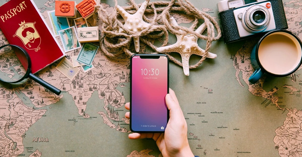 A hand holding a smartphone with a map on it.