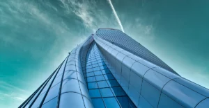 An image of a tall building with a cloudy sky.