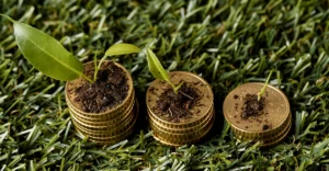 A stack of gold coins with a plant growing out of them.