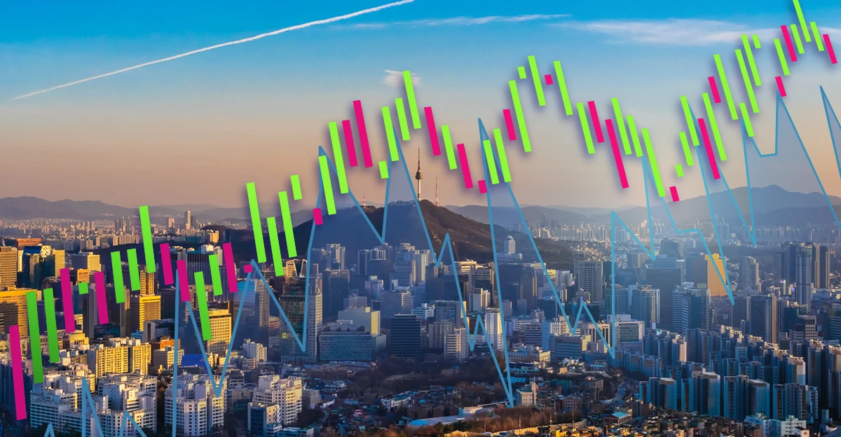 An image of a stock chart with a city in the background.