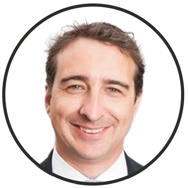 Smiling man in a business suit shown in a circular avatar image for a profile photo.
