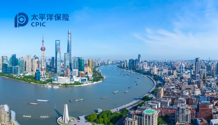 Aerial view of Shanghai skyline along the Huangpu River with tall skyscrapers; CPIC logo in the upper left corner.