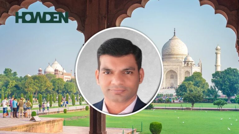 Professional headshot of a man in a circular frame overlaying a park scene with the Taj Mahal in the background, and a Howden logo in the top-left corner.