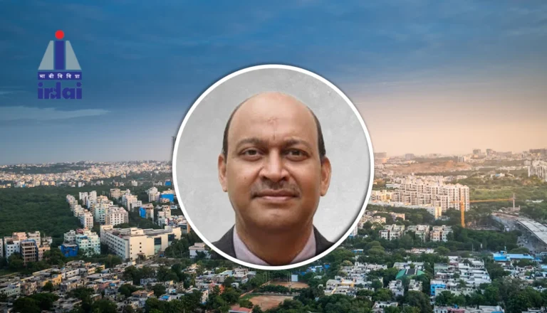 Circular headshot of a man over a city skyline, with the IRDAI logo visible in the top-left corner.