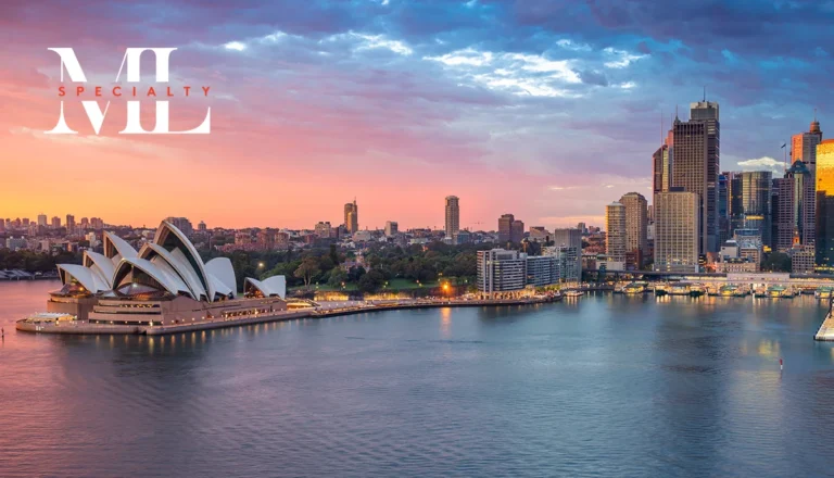 Sunset over Sydney Harbour with the Opera House on the left and a illuminated city skyline, featuring the ML Specialty logo in the upper left.