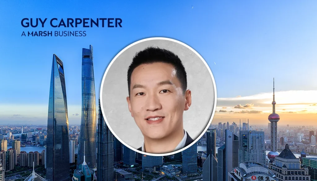 Professional banner featuring a circular headshot of a man over the Shanghai skyline with the text 'GUY CARPENTER' and 'A MARSH BUSINESS'.