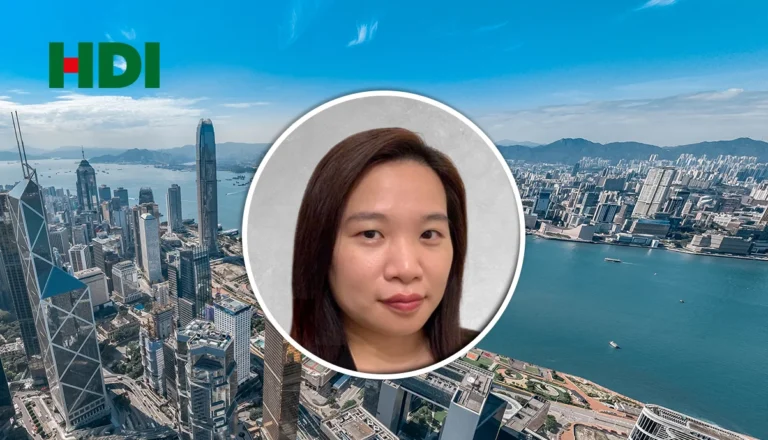 HDI-branded hero image showing Hong Kong skyline with a circular portrait inset in the center-right.