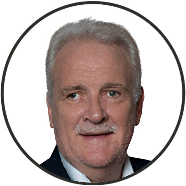 Profile photo of an older man with gray hair and a mustache, wearing a dark suit, inside a circular frame