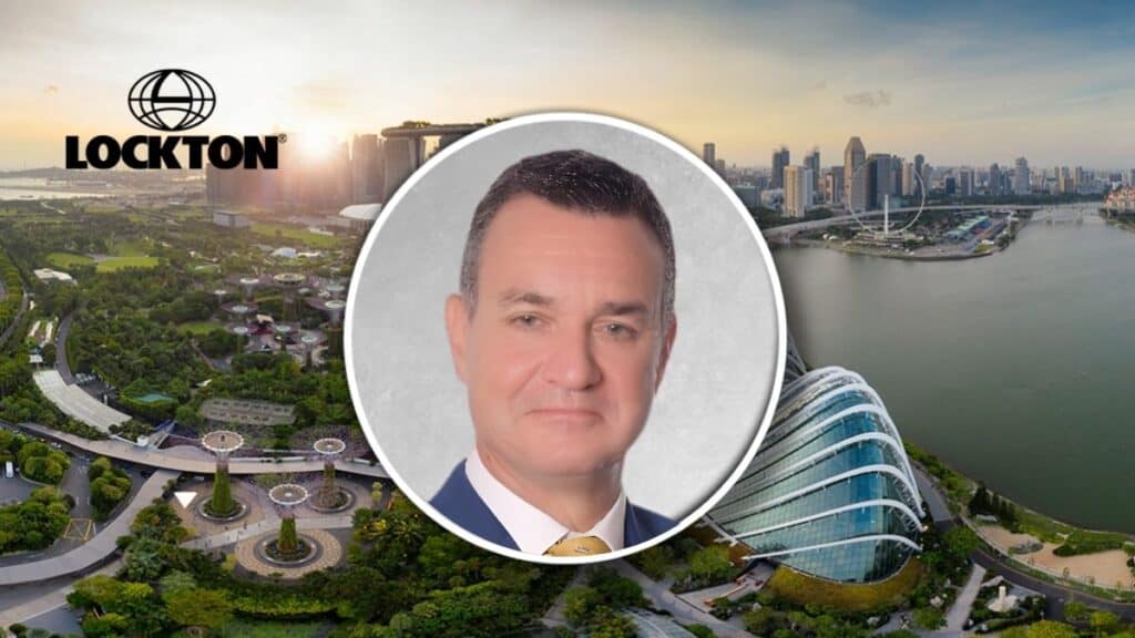 Lockton promotional banner with a circular headshot of a man in a suit over a Singapore city skyline and logo