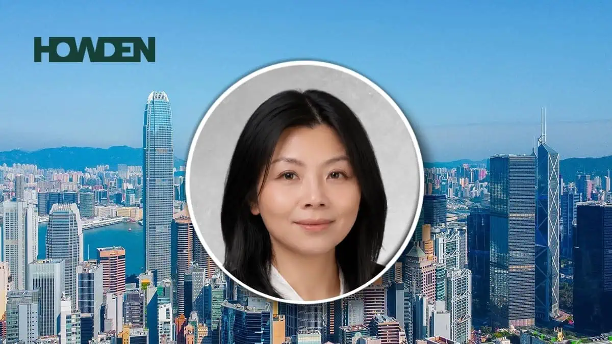 City skyline with blue sky and the HOWDEN logo, overlaid by a circular portrait of an Asian woman in the foreground.