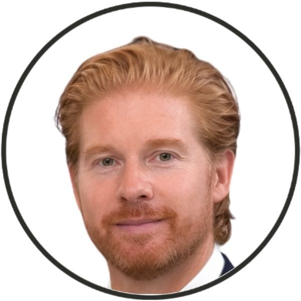 Circular profile avatar: head-and-shoulders portrait of a man with red hair and beard, facing the camera.