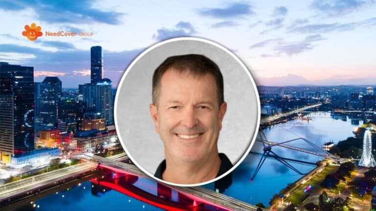 Smiling man’s headshot in a circular frame over a nighttime cityscape with bridges and the NeedCover Group logo in the top-left corner.
