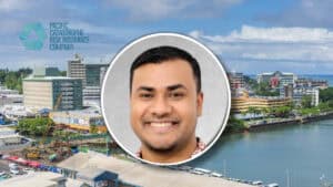 PCRIC appoints Praneel Pritesh as business development advisor Smiling man’s headshot in a circular frame placed over a coastal cityscape with the Pacific Catastrophe Risk Insurance Company logo.