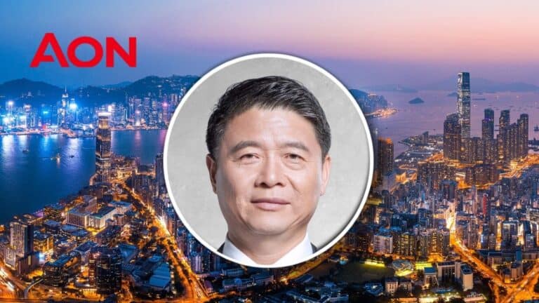 Joe Liang, reinsurance executive chairman for Greater China at Aon, in front of Hong Kong skyline.