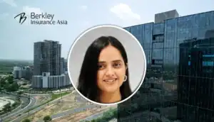 Smiling woman’s circular headshot over a cityscape background with Berkley Insurance Asia branding in the corner.