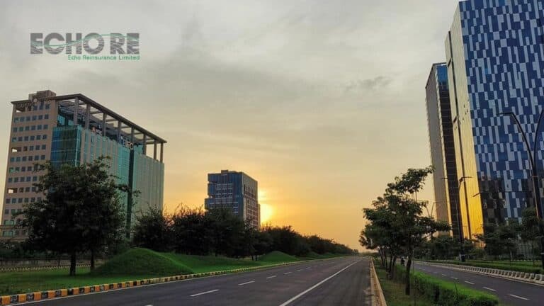 Sunset view along a wide road flanked by modern glass office buildings; Echo Reinsurance Limited logo in the upper left.