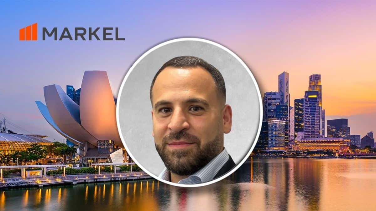 Portrait of a man in a suit inside a circular frame over a city skyline with the MARKEL logo in the top-left corner.