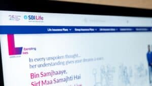 SBI Life insurance homepage hero with the slogan 'In every unspoken thought...' and a pink Hindi line 'Bin Samjhaaye, Sirf Maa Samajhti Hai' beside the SBI Life logo.